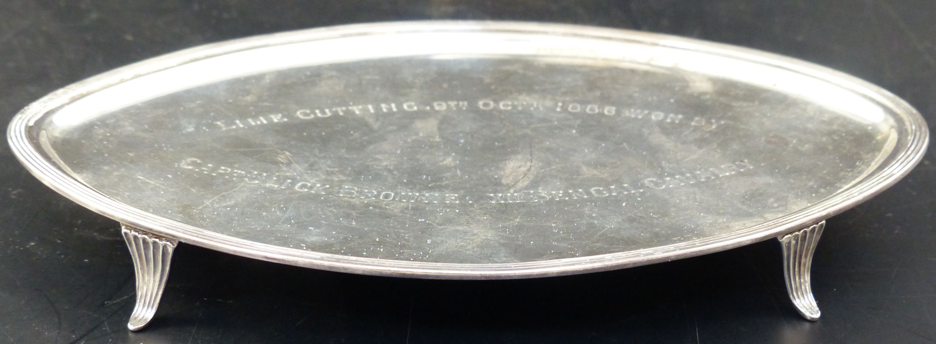 A 19th century Dutch white metal navette shaped teapot stand with engraved presentation inscription